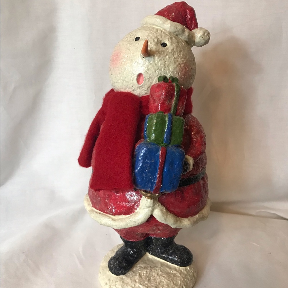 Caroling snowman holding presents